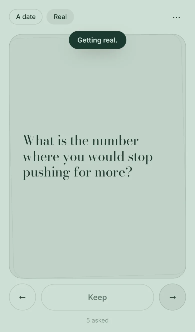 The middle depth on a sage green field, the pill reading Real, with a toast that says Getting real.